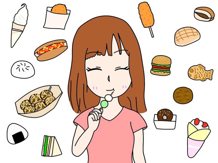 食べ歩きを楽しむ女性