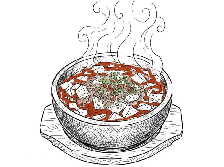 湯気を上げる石鍋の熱々麻婆豆腐
